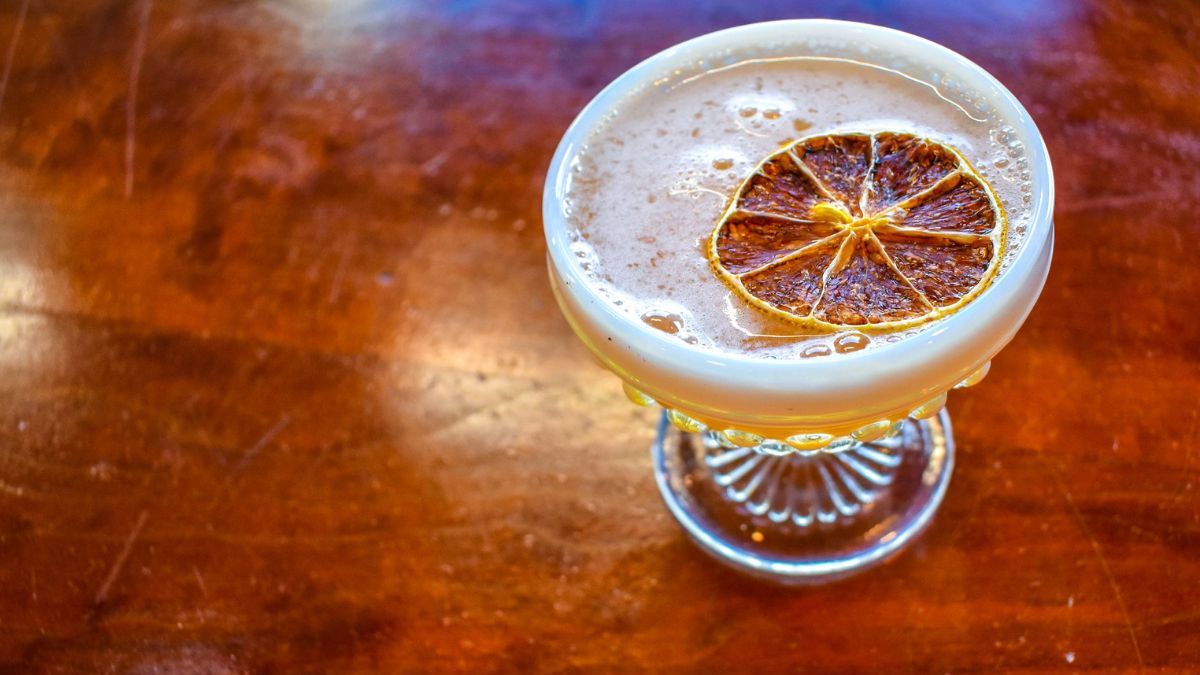 a bowl of oranges on a table